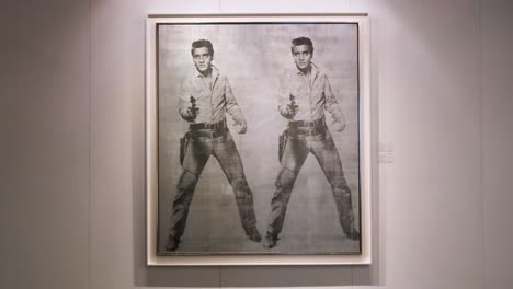 American-artist-Andy-Warhol-art-piece-named-"Doble-Elvis",-depicting-deceased-actor-and-singer-Elvis-Presley,-at-the-world's-largest-brokers-modern-collectibles-Sotheby's-show-in-Hong-Kong