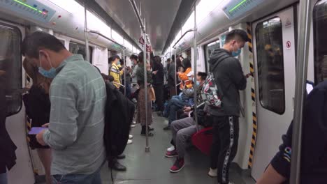 People-traveling-in-metro-carriage,-during-COVID-19-Pandemic-time