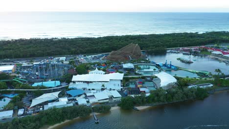 Drones-eye-view-of-Seaworld-Theme-Park-at-sunrise,-new-rollercoaster-being-constructed