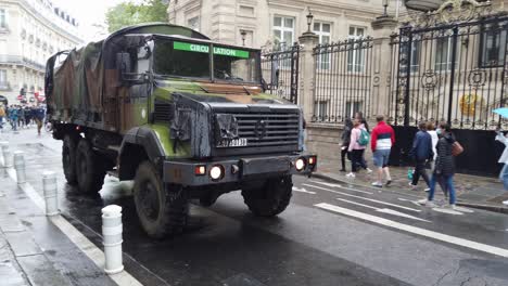 Shot-Of-Rolling-Military-Truck-During-14th-of-July-To-Celebrate-Bastille-Day-Nearby-Champs-Elysées,-Paris-France
