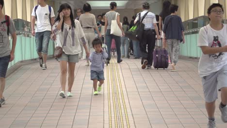 Slow-motion-shot-of-chinese-people-walking-through-the-streets-of-Hong-Kong