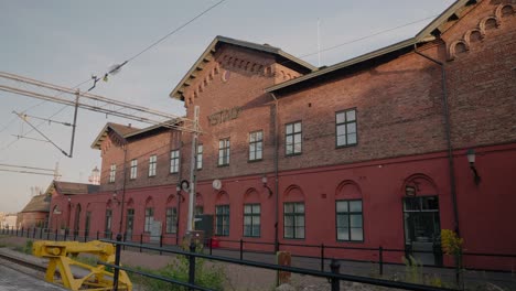 Old-Ystad-Central-Station-Building-in-South-Sweden-Skåne,-Wide-Shot-Handheld