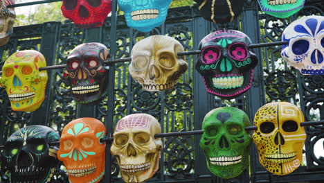 Colorful-calavera-sugar-skulls-on-display-outside-the-entrance-to-Chapultepec-Park-for-Day-of-the-Dead,-Día-de-Muertos-in-Mexico-City