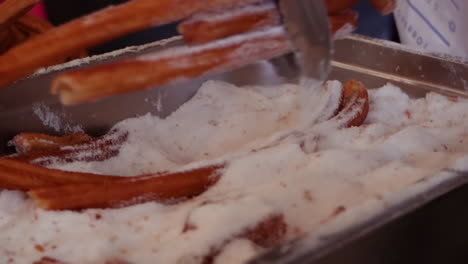 Hot-churros,-churro-is-prepared-by-coating-in-sugar