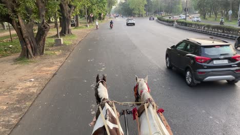 POV-shot-of-Traditional-horse-cart-also-known-as-Tanga-in-Murshidabad,-West-Bengal,-India,-used-mainly-for-carrying-tourists-around-the-city