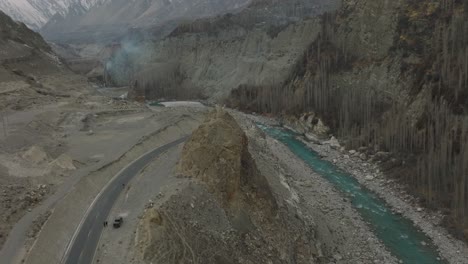 Aerial-View-Of-Karakoram-Highway-Road-Beside-River-At-Hunza-Valley