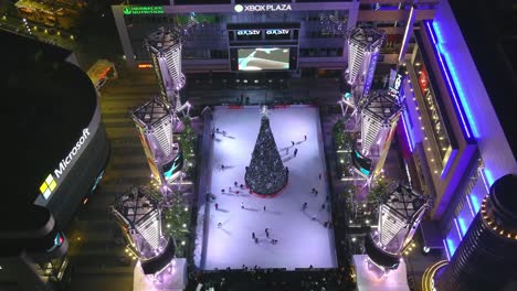 Ice-Skating-Ring-|-Downtown-Los-Angeles-|-Xbox-Plaza-|-LA-Live-|-Christmas-Tree-|-Night-time-|-Overhead-Pass-By-Shot