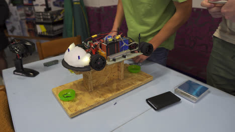 Students-carefully-building-a-small,-electronic-remote-control-racing-car-at-vocational-high-school-in-Slovakia