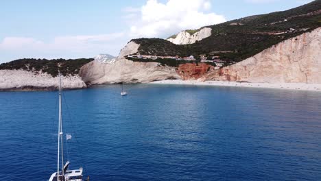 Luxury-Yachts-at-Porto-Katsiki-Beach,-Lefkada-Island,-Greece---Aerial