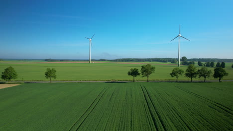 Windmills-over-farmlands.-Aerial-Drone-push-in.