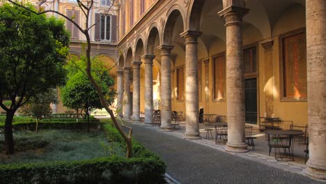 Pan-shot-of-an-empty-courtyard-of-Doria-Pamphilj-gallery-in-Rome,-Italy-at-daytime