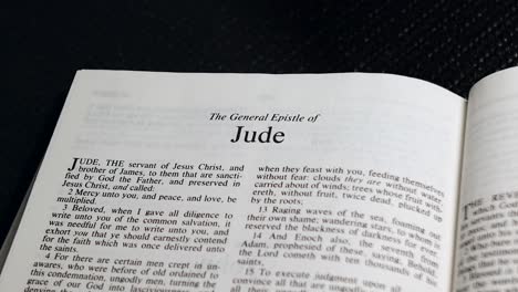 Close-Up-Shot-of-Bible-Page-Turning-to-the-book-of-Jude