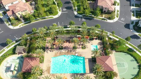 Low-fly-over-a-new-residential-community-in-Irvine,-California-with-an-amazing-private-recreational-park