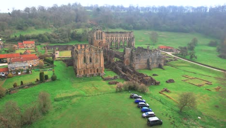 Rievaulx-Abbey-North-York-England,-Seen-from-a-low-aerial-drone-point-of-view