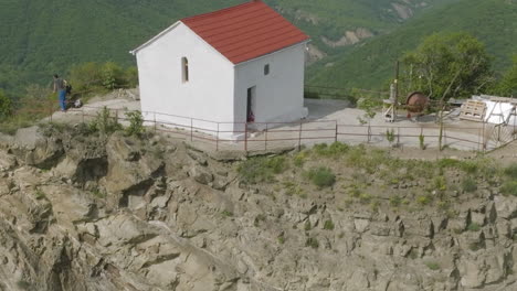 An-Eremite-standing-by-the-house-resembling-church-hidden-in-wilderness