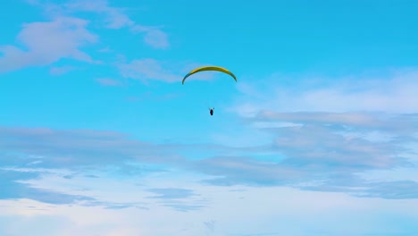Paragliding-in-the-Windy-Blue-Sky-Pan-Right-Slow-Mo-4k