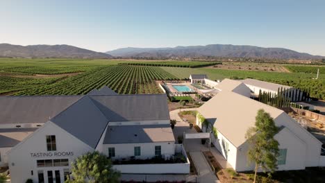 Wine-Tasting-room-and-pool-café-of-the-Bottaia-Winery-in-Temecula,-California---aerial-flyover
