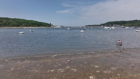 A-low-angle-view-from-Scudder-Park-heading-to-Northport-Marina-on-Long-island-with-anchored-boats