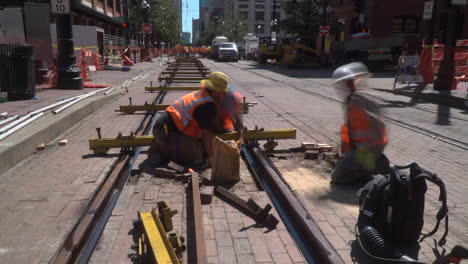 This-is-a-time-lapse-video-of-construction-workers-laying-new-bricks-between-new-tracks-in-a-city