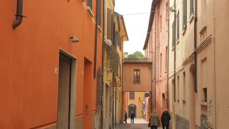 Shot-of-narrow-road-and-arcaded-passageway-in-the-ancient-city-of-Cesena,-Northern-Italy-at-daytime