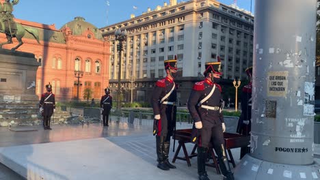 Honor-guards-retire-the-national-flag-at-the-Plaza-de-Mayo-in-Buenos-Aires,-Argentina