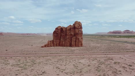 Rock-Formation-Standing-Alone-in-Arid,-Desolate-Desert-of-Arizona,-Aerial