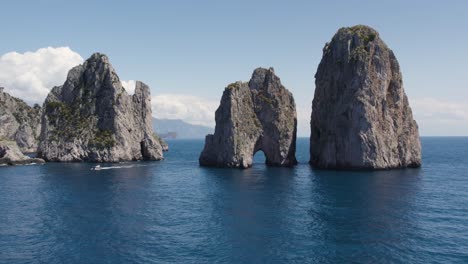 Rock-Natural-Archway-of-the-Capri-Faraglioni-Sea-Stacks-in-Italy---Aerial