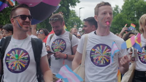 Slow-motion-gimbal-shot-past-diverse-group-of-Pride-marchers
