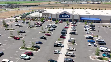 Orbiting-aerial-shot-of-a-Lowe's-parking-lot
