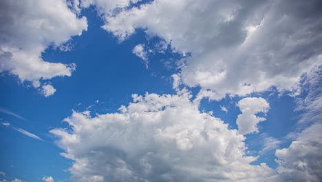 Blue-sky-with-fluffy-white-clouds-moving-time-lapse