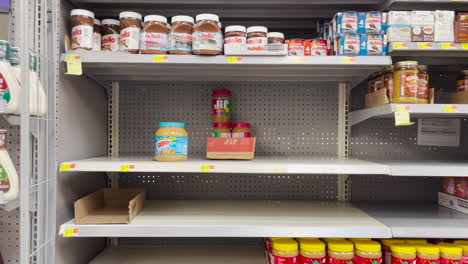 Empty-peanut-butter-shelves-at-Walmart-grocery-store