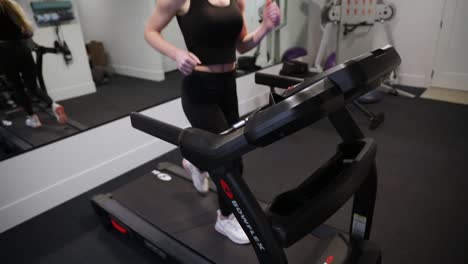 Fit-Young-Woman-Running-and-Exercising-on-a-Bowflex-Treadmill