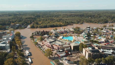 Aerial-View-Of-Costa-Park-Amusement-Rides-And-Lujan-River-In-Tigre,-Buenos-Aires,-Argentina