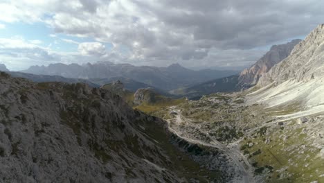 Aerial-of-Valley-in-the-Italian-Dolomites-with-an-Empty-Road