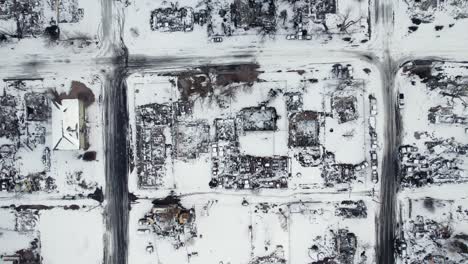 Drone-Aerial-View-of-Snow-Covered-Burnt-Down-Neighborhood-Homes-and-Buildings-in-Superior-Colorado-Boulder-County-USA-After-Marshall-Fire-Wildfire-Disaster