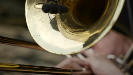 A-Classic-golden-trumpet-with-microphone-being-played-extremely-close-up