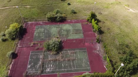 Abandoned-Tennis-Court-In-Condemned-Sugar-Loaf-Ski-Resort,-Leelanau-County,-Michigan,-USA