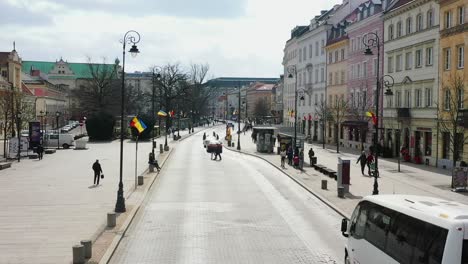 Aerial-view-of-people-and-traffic-on-the-Royal-route,-in-sunny-Warsaw,-Poland