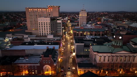 Rising-aerial-of-downtown-Lancaster-city-at-night