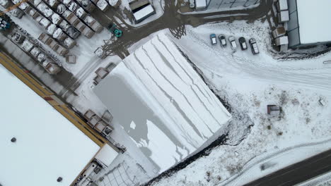Top-Down-View-Of-Fishing-Port-Covered-By-Fresh-Winter-Snow-In-Skjervøy,-Troms-County,-Northern-Norway