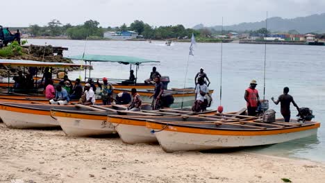 People-and-motorboat-water-taxis-at-Kokopau-Buka-Passage-boat-crossing-on-the-tropical-island-of-Autonomous-Region-of-Bougainville,-Papua-New-Guinea