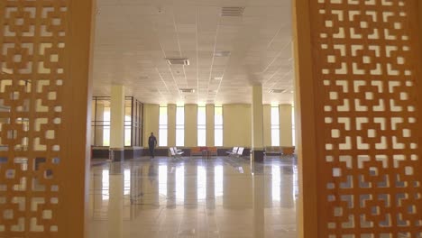 POV-Walking-Past-Room-Dividers-Into-Empty-Airport-Lounge-With-Mai-Bakhtawar-Airport