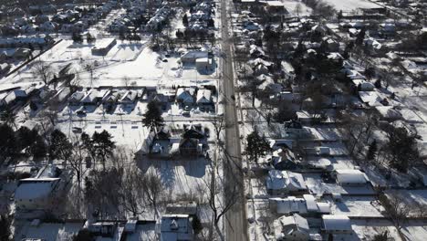 Aerial-of-suburban-neighborhood-sunny-winter-day