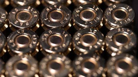 slow-slide-over-the-back-of-9mm-ammunition-and-shell-primer