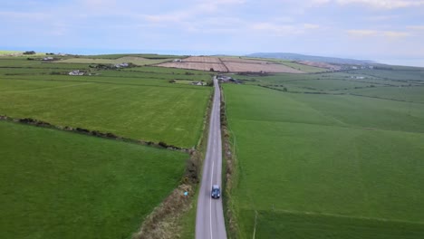 Spring-is-just-around-the-corner-an-aerial-footage-of-the-road-leading-to-the-Old-Head-peninsula-near-Kinsale-with-green-farmlands