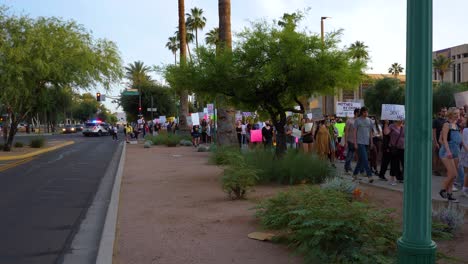 protesters-marching-on-the-sidewalk-in-Phoenix-Arizona