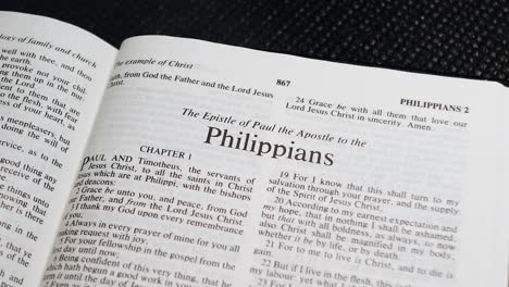 Close-Up-Shot-of-Bible-Page-Turning-to-the-book-of-Philippians