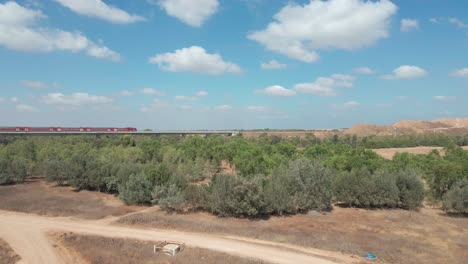 Train-Crosses-Green-Field-At-Southern-District-City-Netivot,-Israel
