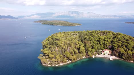 Madouri-Island-and-Monastery-at-Nidri,-Lefkada,-Greece---Scenic-Aerial-Forward