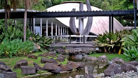 A-chapel-with-a-koi-pond-around-it,-in-the-heart-of-Greenbelt-Park,-Makati,-Metro-Manila